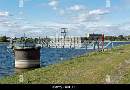 Water valve with bridge over reservoir, Walthamstow Wetlands. Stock Photo