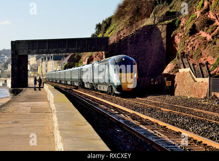 A GWR Class 800 IET headed by power car No 800316, leaving Dawlish under Rockstone Black Bridge with the 1132 Paignton to Paddington, 09.01.2019. Stock Photo