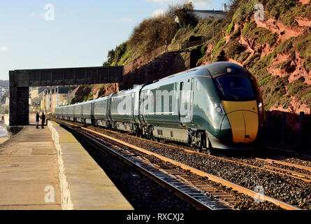 A GWR Class 800 IET headed by power car No 800316, leaving Dawlish under Rockstone Black Bridge with the 1132 Paignton to Paddington, 09.01.2019. Stock Photo