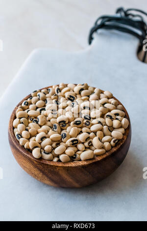 Raw Organic Fresh Black Eye Peas in Wooden Bowl. Organic Food. Stock Photo