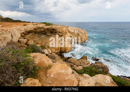 Beautiful Cape Greco Kamara Tou Koraka stone arch during cloudy weather. Landscape taken on Cyprus island. Stock Photo