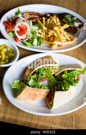 Barbecue food set in local restaurant in Larnaca. Traditional cypriot food on Cyprus island. Stock Photo