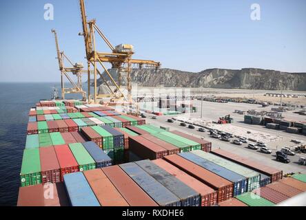 (180309) -- BEIJING, March 9, 2019 (Xinhua) -- Photo taken on Nov. 13, 2016 shows the COSCO Wellington cargo vessel with containers moored at Gwadar port, Pakistan. (Xinhua/Liu Tian) Stock Photo