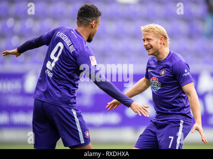 Aue, Germany. 09th Mar, 2019. Soccer: 2nd Bundesliga, Erzgebirge Aue - SC Paderborn 07, 25th matchday, in the Sparkassen-Erzgebirgsstadion. Aues Emmanuel Iyoha (l) cheers after his goal to 1-0 with Jan Hochscheidt. Credit: Robert Michael/dpa-Zentralbild/dpa - IMPORTANT NOTE: In accordance with the requirements of the DFL Deutsche Fußball Liga or the DFB Deutscher Fußball-Bund, it is prohibited to use or have used photographs taken in the stadium and/or the match in the form of sequence images and/or video-like photo sequences. Credit: dpa picture alliance/Alamy Live News Stock Photo