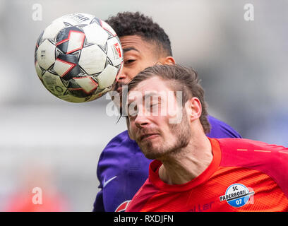 Aue, Germany. 09th Mar, 2019. Soccer: 2nd Bundesliga, Erzgebirge Aue - SC Paderborn 07, 25th matchday, in the Sparkassen-Erzgebirgsstadion. Aues Emmanuel Iyoha (l) against Paderborn's Christian Strohdiek. Credit: Robert Michael/dpa-Zentralbild/dpa - IMPORTANT NOTE: In accordance with the requirements of the DFL Deutsche Fußball Liga or the DFB Deutscher Fußball-Bund, it is prohibited to use or have used photographs taken in the stadium and/or the match in the form of sequence images and/or video-like photo sequences. Credit: dpa picture alliance/Alamy Live News Stock Photo