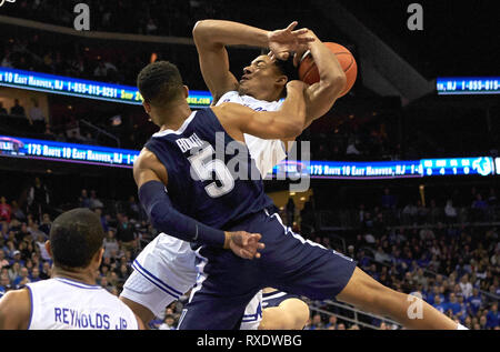 Newark, New Jersey, USA. 9th Mar, 2019. Seton Hall Pirates guard Jared Rhoden (14) is fouled by Villanova Wildcats guard Phil Booth (5) in the first half between the Villanova Wildcats and the Seton Hall Pirates at the Prudential Center in Newark, New Jersey. Duncan Williams/CSM/Alamy Live News Stock Photo