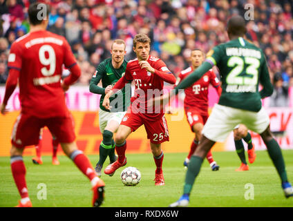 Munich, Germany. 09th Mar, 2019. Thomas MUELLER, MÜLLER, FCB 25 compete for the ball, tackling, duel, header, action, fight against Maximilian ARNOLD, WOB 27 FC BAYERN MUNICH - VFL WOLFSBURG 6-0 - DFL REGULATIONS PROHIBIT ANY USE OF PHOTOGRAPHS as IMAGE SEQUENCES and/or QUASI-VIDEO - 1.German Soccer League, Munich, March 09, 2019 Season 2018/2019, matchday 25, FCB, München, Credit: Peter Schatz/Alamy Live News Stock Photo