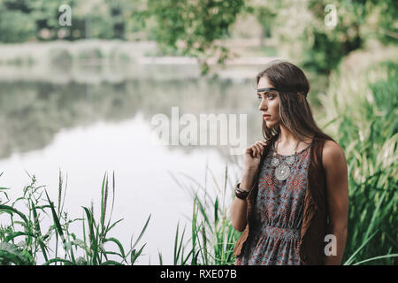 beautiful hippie girl on spring forest background Stock Photo