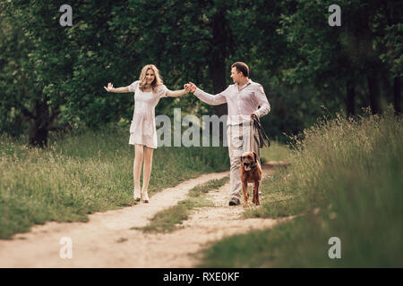 happy young family on a walk in the city Park . Stock Photo