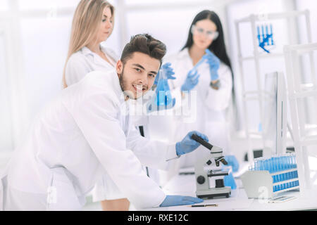 group of young scientist experimenting in the laboratory Stock Photo