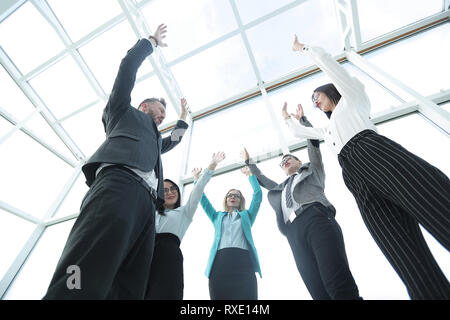 Business group with their hands in the air Stock Photo
