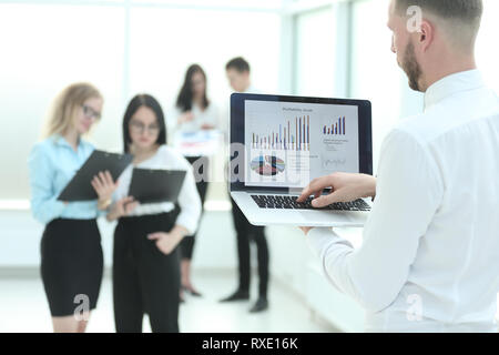 close up. businessman uses laptop to check financial statistics. Stock Photo