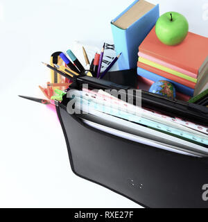 close up. briefcase, hourglass and school supplies on white background Stock Photo