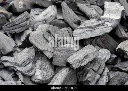 black charcoal pile texture background selective focus Stock Photo