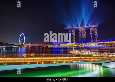 SINGAPORE CITY, SINGAPORE - MARCH 3, 2019: Spectra Light and Water Show Marina Bay Sand Casino Hotel Downtown Singapore Stock Photo