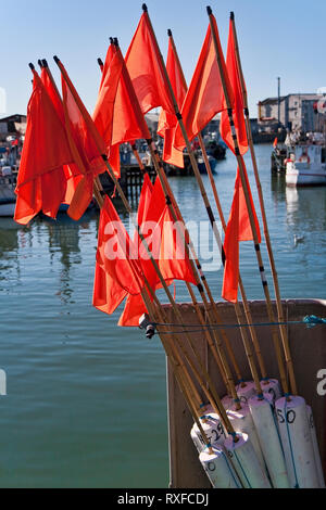 Fishing buoys with red flags on a fishing vessel