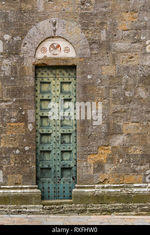 Doorway of Baptistery of San Giovanni  in Volterra, a walled town southwest of Florence, Italy Stock Photo