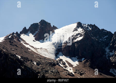 Landscape of Shymbulak Mountains with glacier during the summer, Kazakhstan Stock Photo
