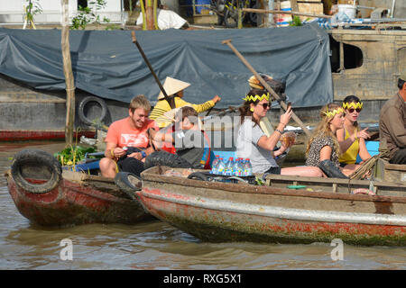 Phong Dien, Vietnam - December 31st 2017. Tourist on a boat tour at the Phong Dien Floating Market near Can Tho in the Mekong Delta Stock Photo