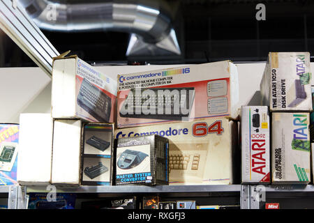 Milan, Italy - March 8 2019 Cartoomics Comic Con Vintage computer model commodore 64 being sold Stock Photo