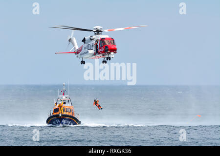 Coast Guard Helicopter. The rescue operation on the sea Stock Photo