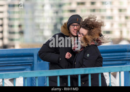 Strong winds have hit the capital as people cross Tower Bridge, London, UK during the Vitality Big Half marathon Stock Photo