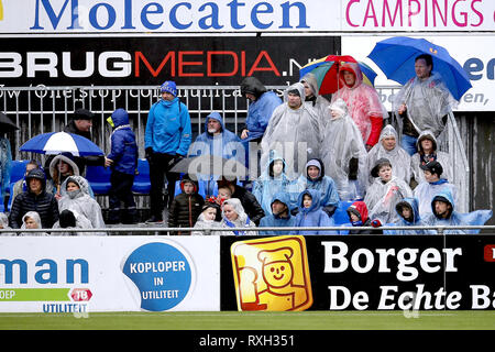 ZWOLLE , 10-03-2019 , MAC3PARK stadion , season 2018 / 2019 , Dutch Eredivisie . Fans and supporters of PEC in the rain during the game PEC - AZ . Stock Photo