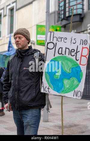 Cardiff, Wales, UK. 10th Mar 2019. Extinction Rebellion march finishes outside of Barclays. The Extinction Rebellion is an international social movment that aims to drive radical change through nonviolent resistance. This march took place in Cardiff closing down Castle Street. The protest outside Barclays was to highlight Barclays investment in fossil fuels. © JaiAshton Credit: Jai Ashton/Alamy Live News Stock Photo