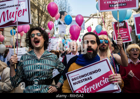 Madrid, Spain. 10th March, 2019. Men dressed like women taking part in a protest where conservative, far right wing and ultra Catholic groups demonstrate under the slogan 'In feminine yes, and masculine too' in a march organized by the platform 'Women of the World'. The protest against what they call 'supremacist feminism' is part of the activities of the International Women's Day. Credit: Marcos del Mazo/Alamy Live News Stock Photo