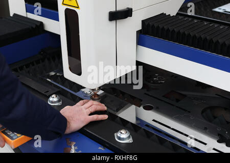 Laser cutting machine with CNC control in process. Stock Photo