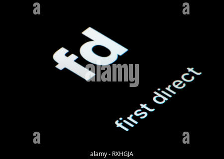A close-up shot of the First Direct app icon, as seen on the screen of ...