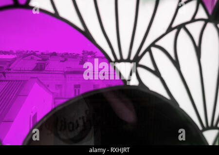 Colorful Stained-Glass Window. Abstract Multicolored Background. City Behind Glass Stock Photo
