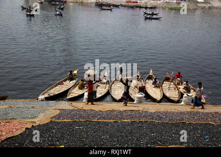 Recycled plastic chips drying on the bank of the Buriganga River in Dhaka, Bangladesh. Stock Photo