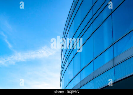 Building exterior with bright blue sky background Stock Photo