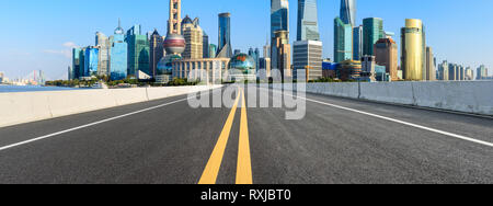 Asphalt road passes through Shanghai Lujiazui Financial District Stock Photo