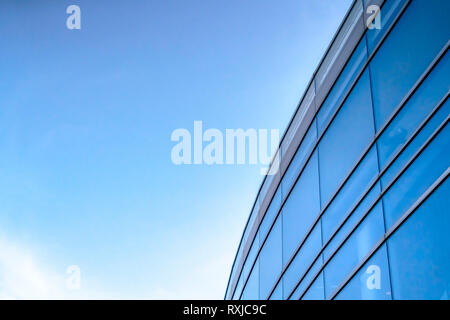 Modern building exterior with blue sky overhead Stock Photo