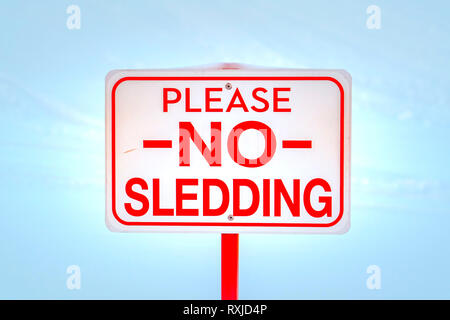 Please No Sledding sign against snow in winter Stock Photo