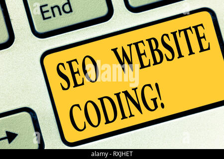 Writing note showing Seo Website Coding. Business photo showcasing create site in way make it more visible to search engine Keyboard key Intention to  Stock Photo