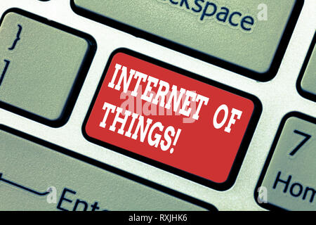 Writing note showing Internet Of Things. Business photo showcasing interconnection via Internet computing devices embedded Keyboard key Intention to c Stock Photo