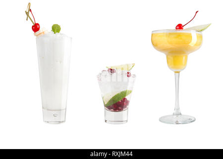A variety of alcoholic drinks, beverages and cocktails on a white background. Three popular drinks in different glass goblets. Isolated. Stock Photo