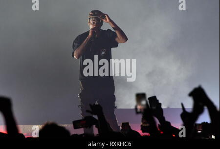 Rapper, singer, songwriter and record producer, Jacques Webster II, known professionally as Travis Scott, is shown performing on stage during a 'live' concert appearance. Stock Photo