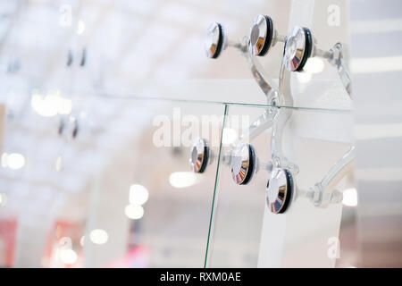 Glass facades and walls. Metal fasteners. Selective focus Stock Photo