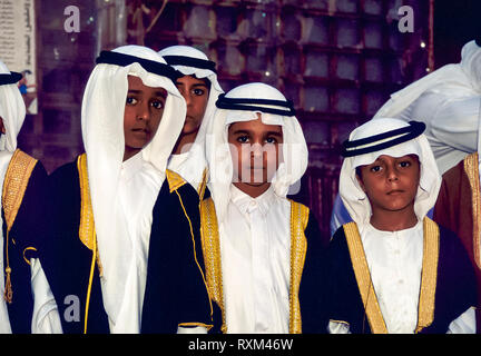 Arab folklore and history with young Sheikhs proudly dressed during the Dubai Trade Festival in the United Arab Emirates Stock Photo