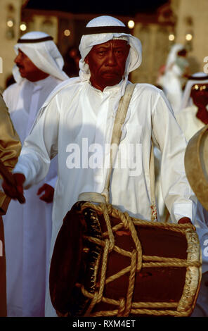 Arab folklore and history with an Emirati band member with his drum during the Dubai Trade Festival in the United Arab Emirates Stock Photo