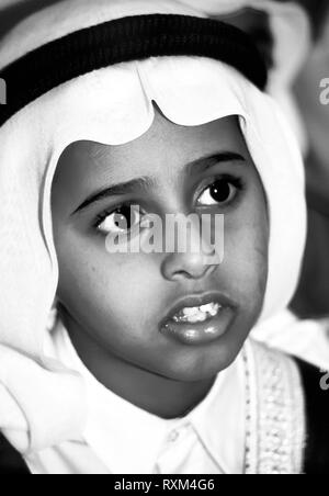 Arab folklore and history with young Emitrati boys during the Dubai Trade Festival in the United Arab Emirates Stock Photo