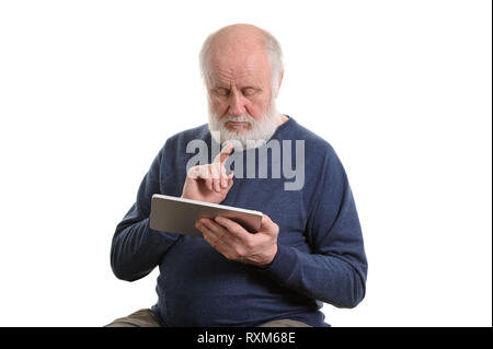 Funny old man using tablet computer isolated on white Stock Photo