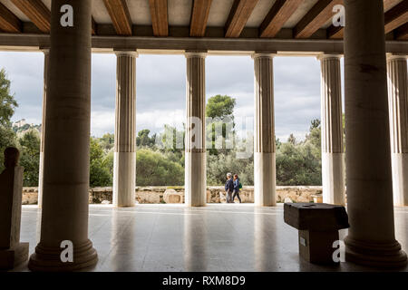 Athens, Greece – February 7, 2019: A man visit ancient site of Stoa Attalosa in Athens Agora. Stock Photo