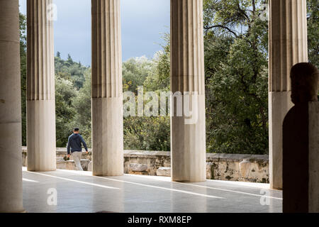 Athens, Greece – February 7, 2019: A man visit ancient site of Stoa Attalosa in Athens Agora. Stock Photo