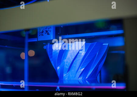 Three dimensional printing machine prints physical 3D model Stock Photo