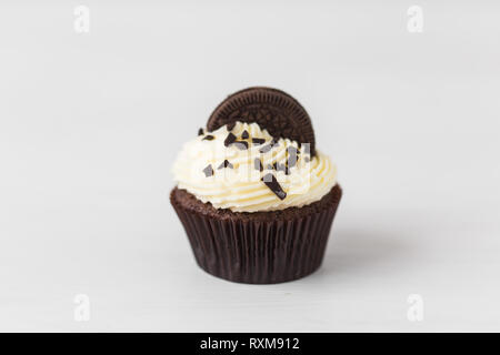 Food and holiday concept - Close up of birthday cupcake over white background Stock Photo